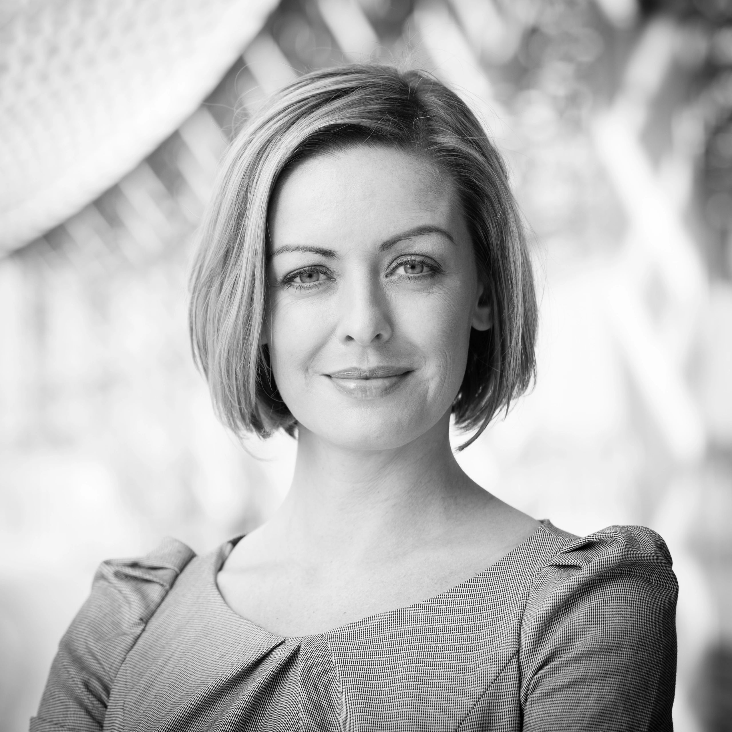 Headshot of a professional smiling