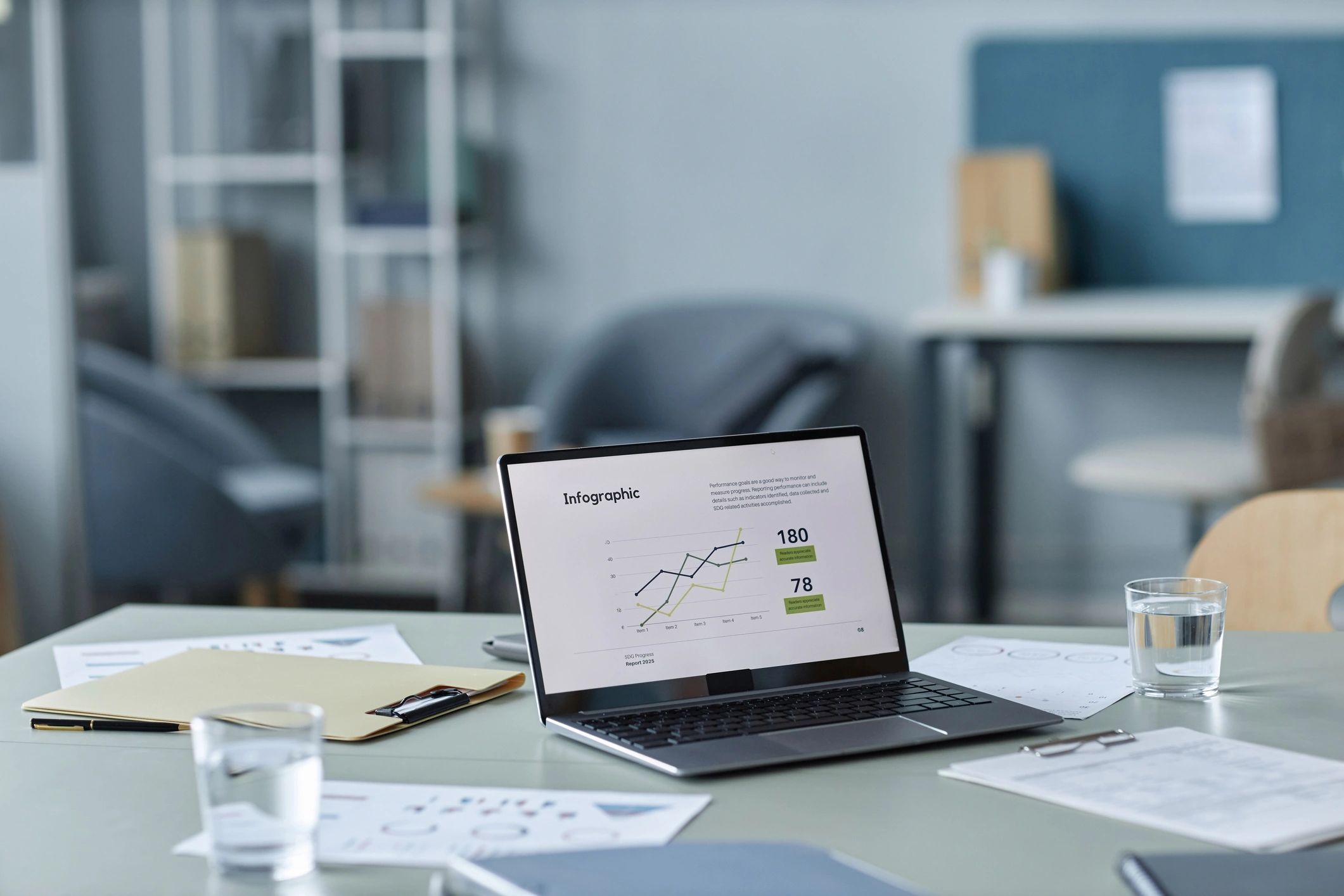 Laptop on desk showing analytics chart